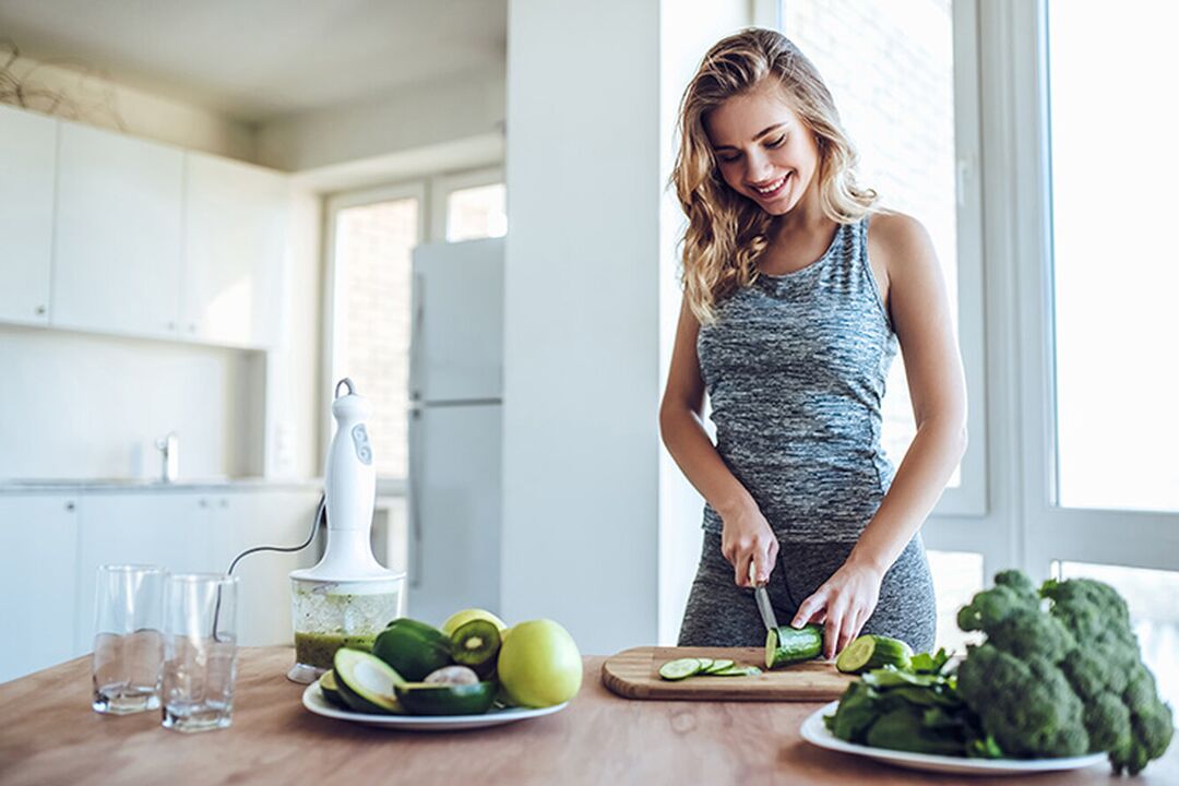 The girl prepares a healthy diet after calculating the daily calorie intake